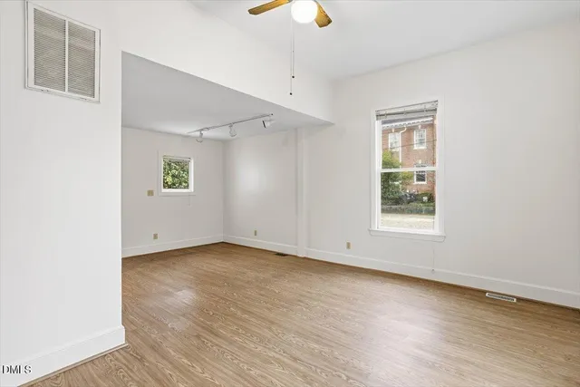 a kitchen with stainless steel appliances a sink and cabinets