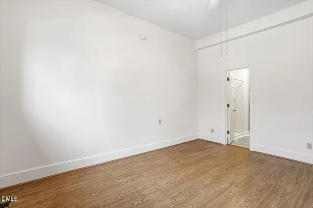 a view of a pathway both side of house