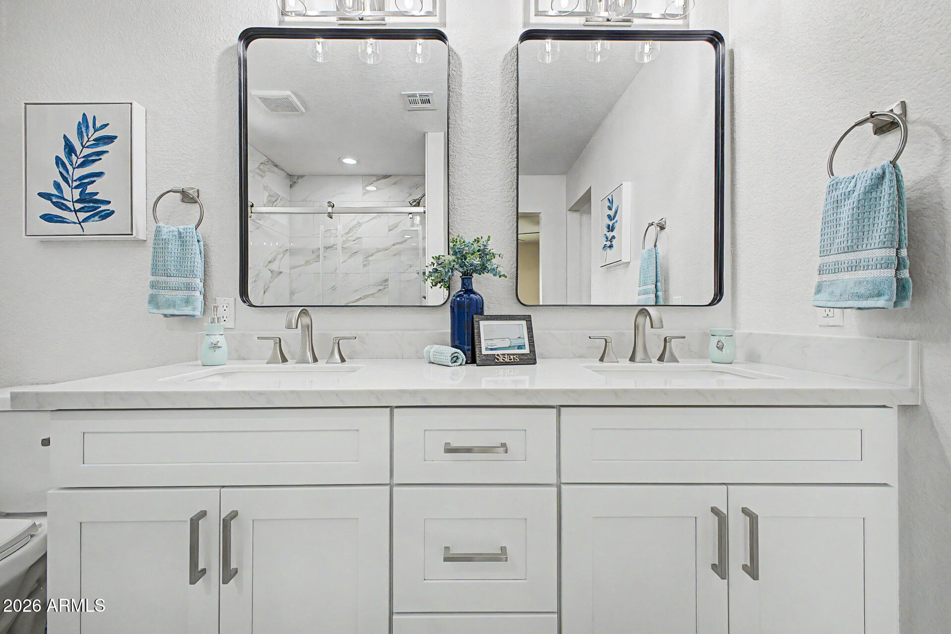 1009 West Pampa Avenue Mesa, AZ 85210 - Photo 17 of 31 a bathroom with double vanity sink and two mirror