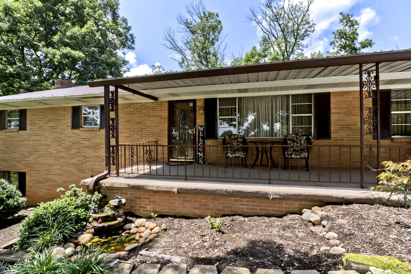1038 Kirk Road Greenback, TN 37742 - Photo 3 of 40 03_KirkRoad_1038_FrontWaterFeature