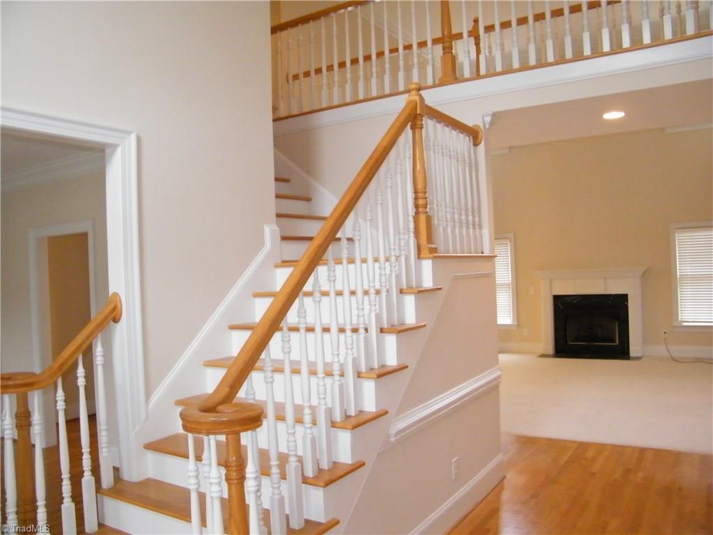 8413 Case Ridge Drive Oak Ridge, NC 27310 - Photo 11 of 30 Dual entry staircase in foyer and kitchen