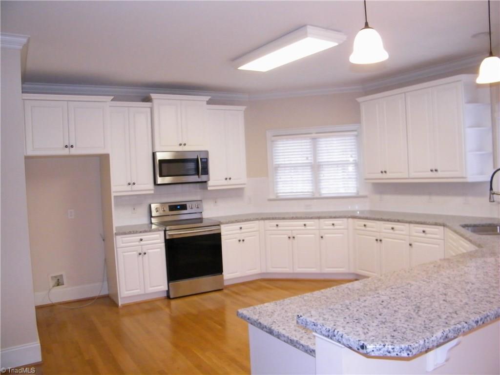 8413 Case Ridge Drive Oak Ridge, NC 27310 - Photo 6 of 30 Newly installed granite countertops and range