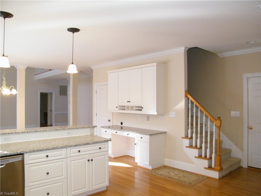 8413 Case Ridge Drive Oak Ridge, NC 27310 - Photo 10 of 30 Dual staircase to kitchen
