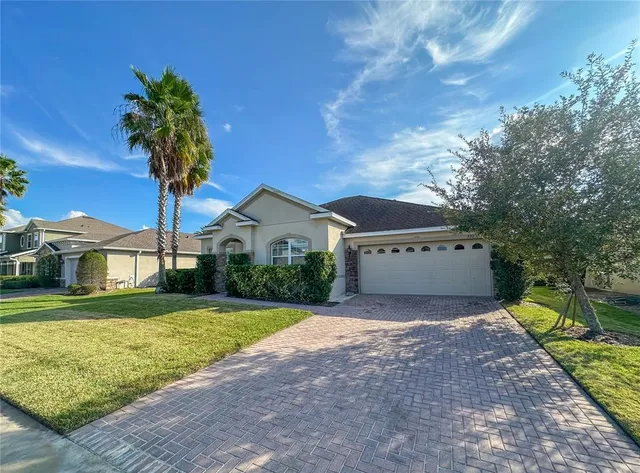 a front view of house with yard and green space