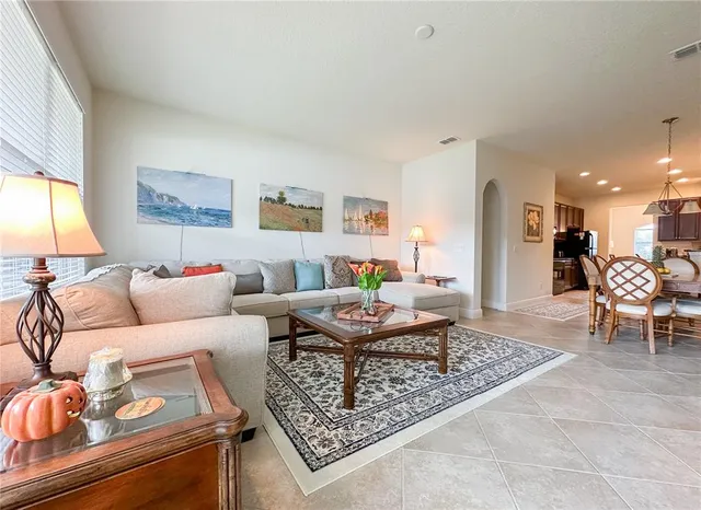 a living room with furniture and a table