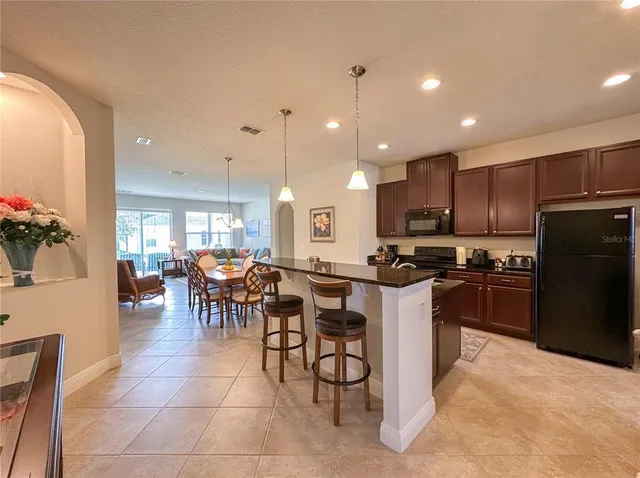 a kitchen with a table and chairs in it