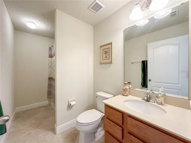 a bathroom with a sink toilet and vanity