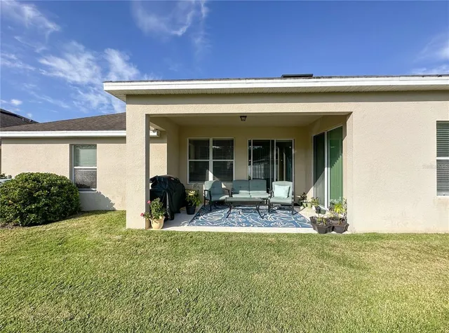a view of the front of house with outdoor seating