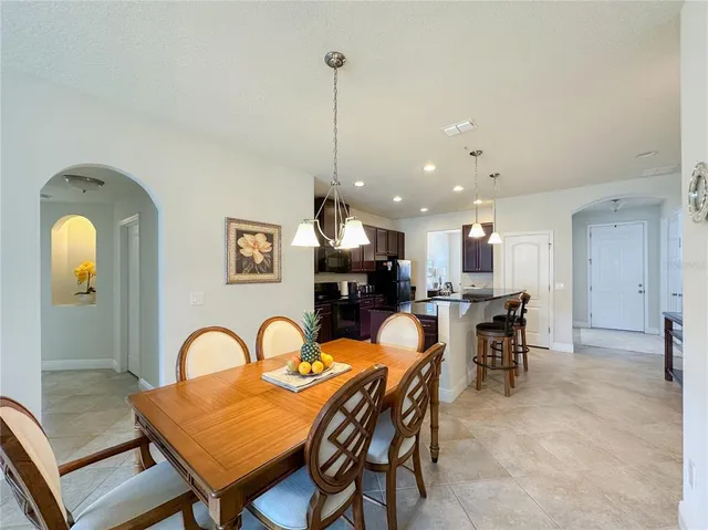 a dining room with furniture and window