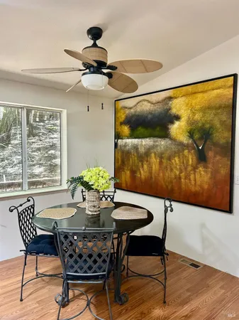 a dining room with furniture and window