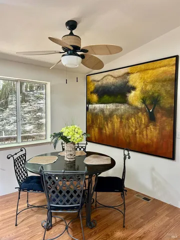 a dining room with furniture and window