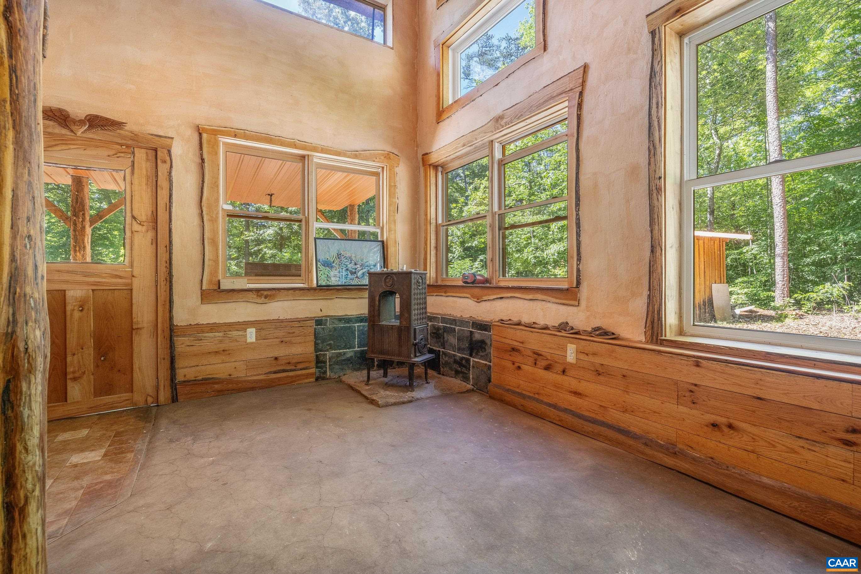7676 Old Dominion Road Schuyler, VA 22969 - Photo 18 of 29 a room with furniture and a large window