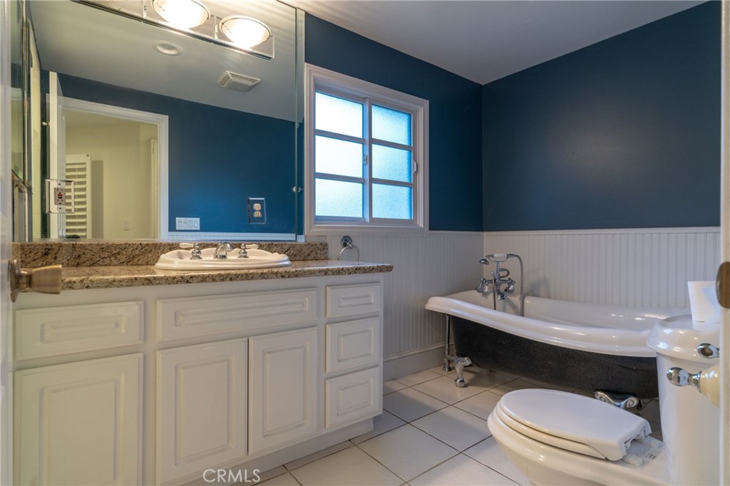 1735 Claridge Street Arcadia, CA 91006 - Photo 12 of 18 a bathroom with a sink toilet and mirror