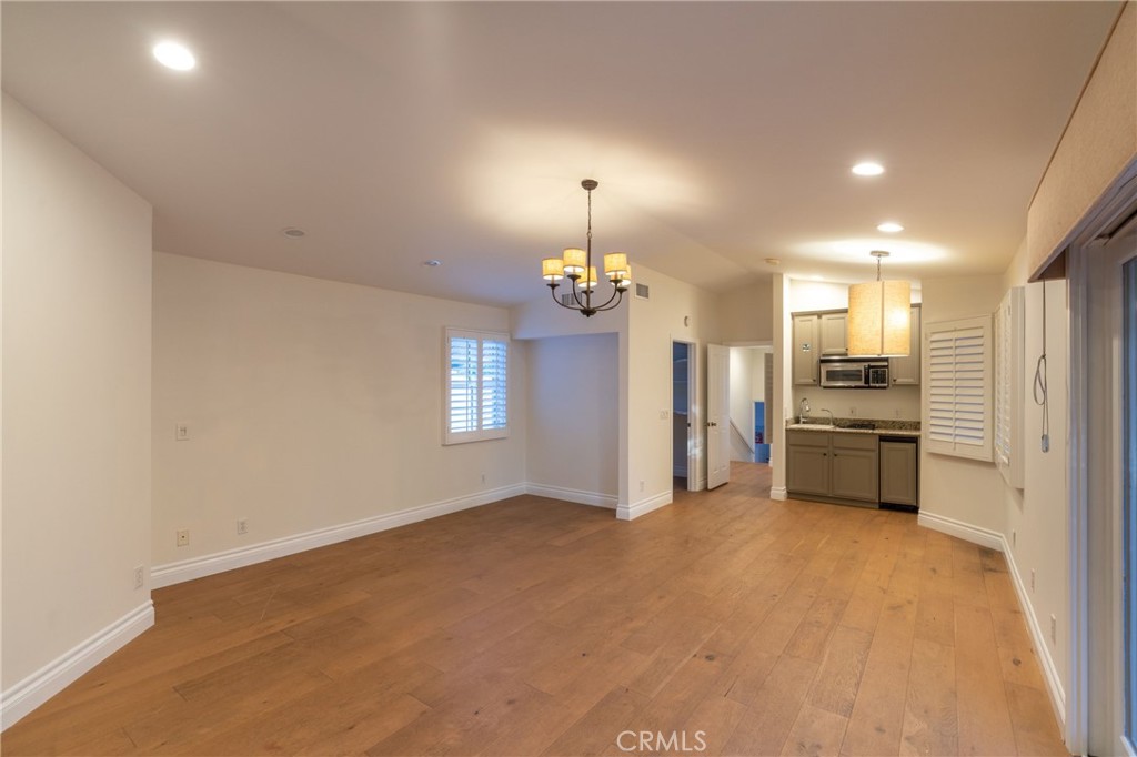 1735 Claridge Street Arcadia, CA 91006 - Photo 13 of 18 an empty room with kitchen appliances and a ceiling fan