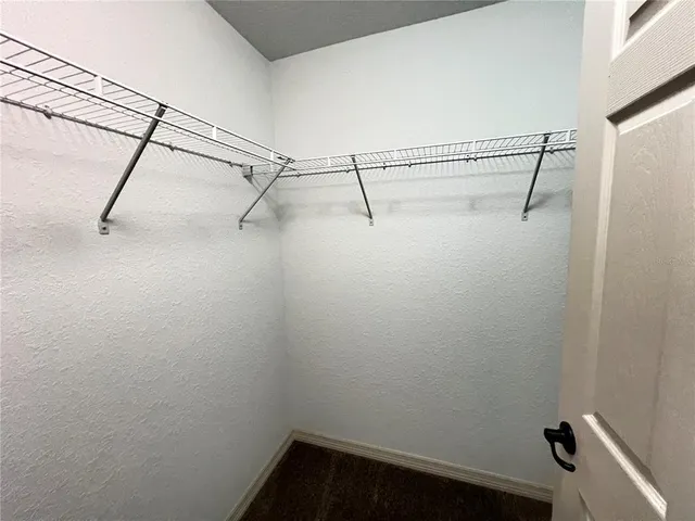 a view of an empty walk in closet
