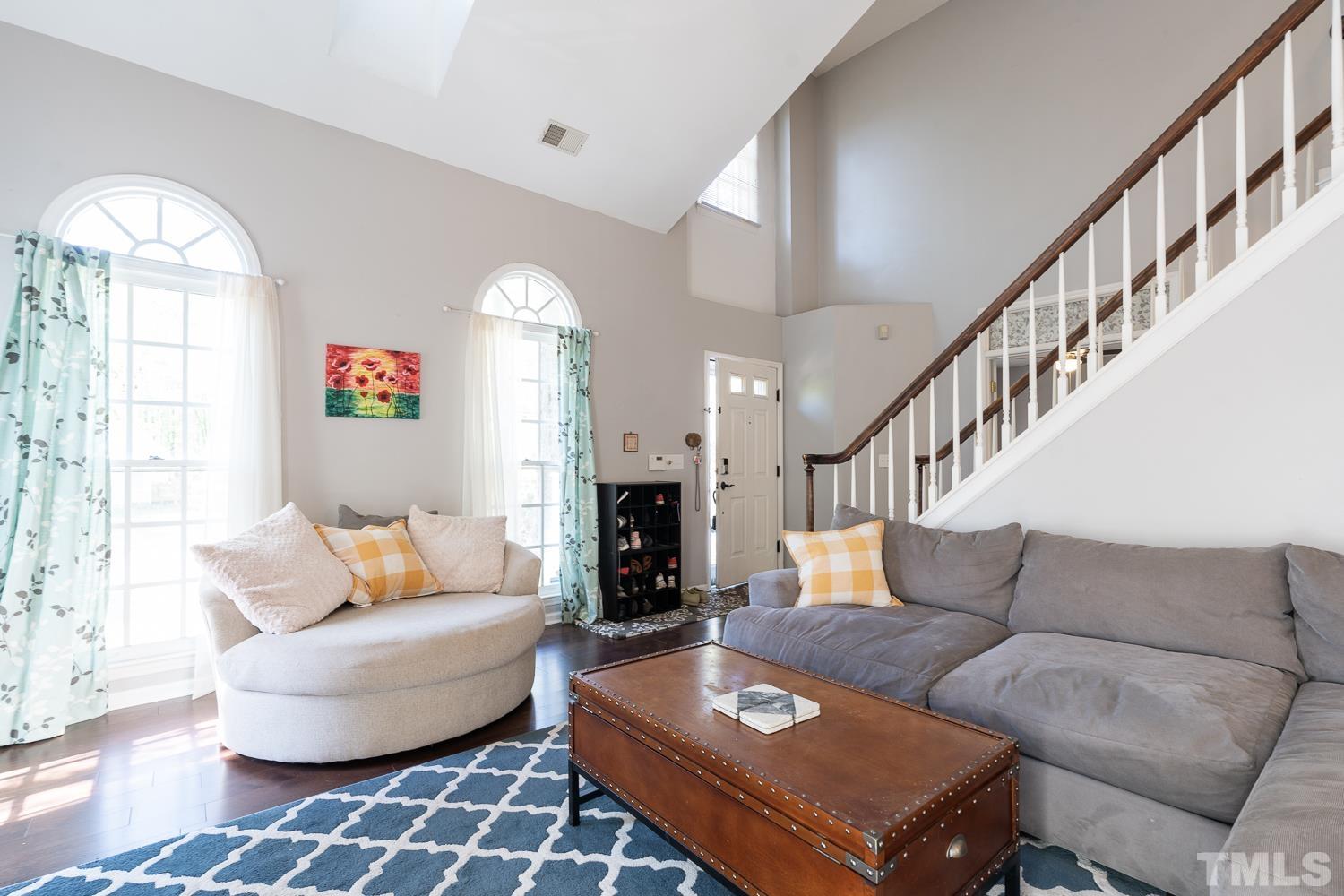 3604 Norway Court Raleigh, NC 27616 - Photo 12 of 26 a living room with furniture and a fireplace
