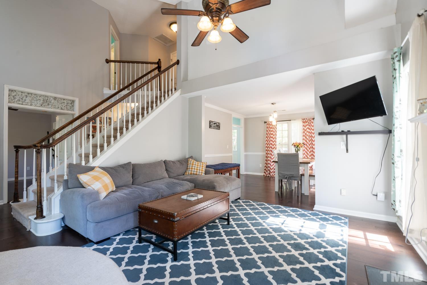 3604 Norway Court Raleigh, NC 27616 - Photo 13 of 26 a living room with furniture and a flat screen tv