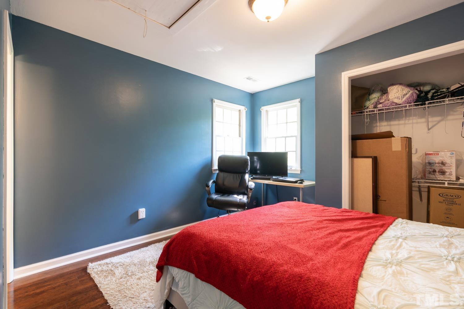 3604 Norway Court Raleigh, NC 27616 - Photo 16 of 26 a bed room with a bed and a television