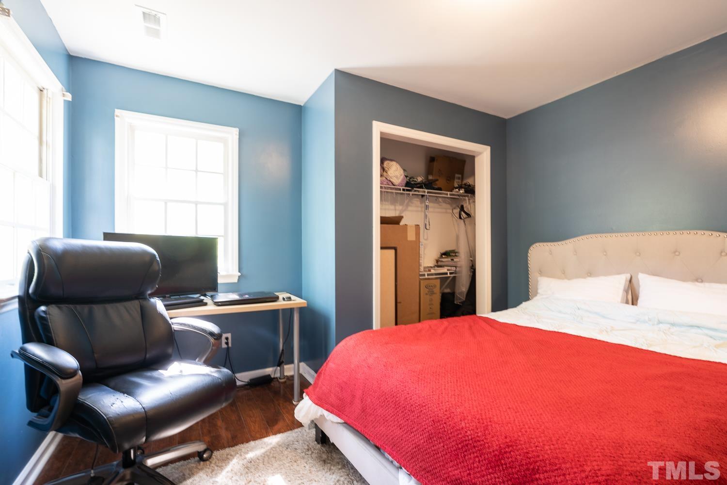 3604 Norway Court Raleigh, NC 27616 - Photo 17 of 26 a bedroom with a bed and chair