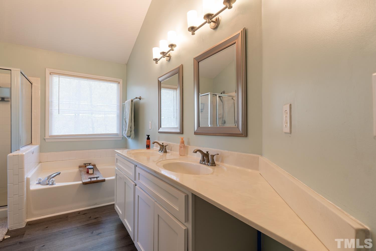 3604 Norway Court Raleigh, NC 27616 - Photo 21 of 26 a bathroom with a sink and a bathtub