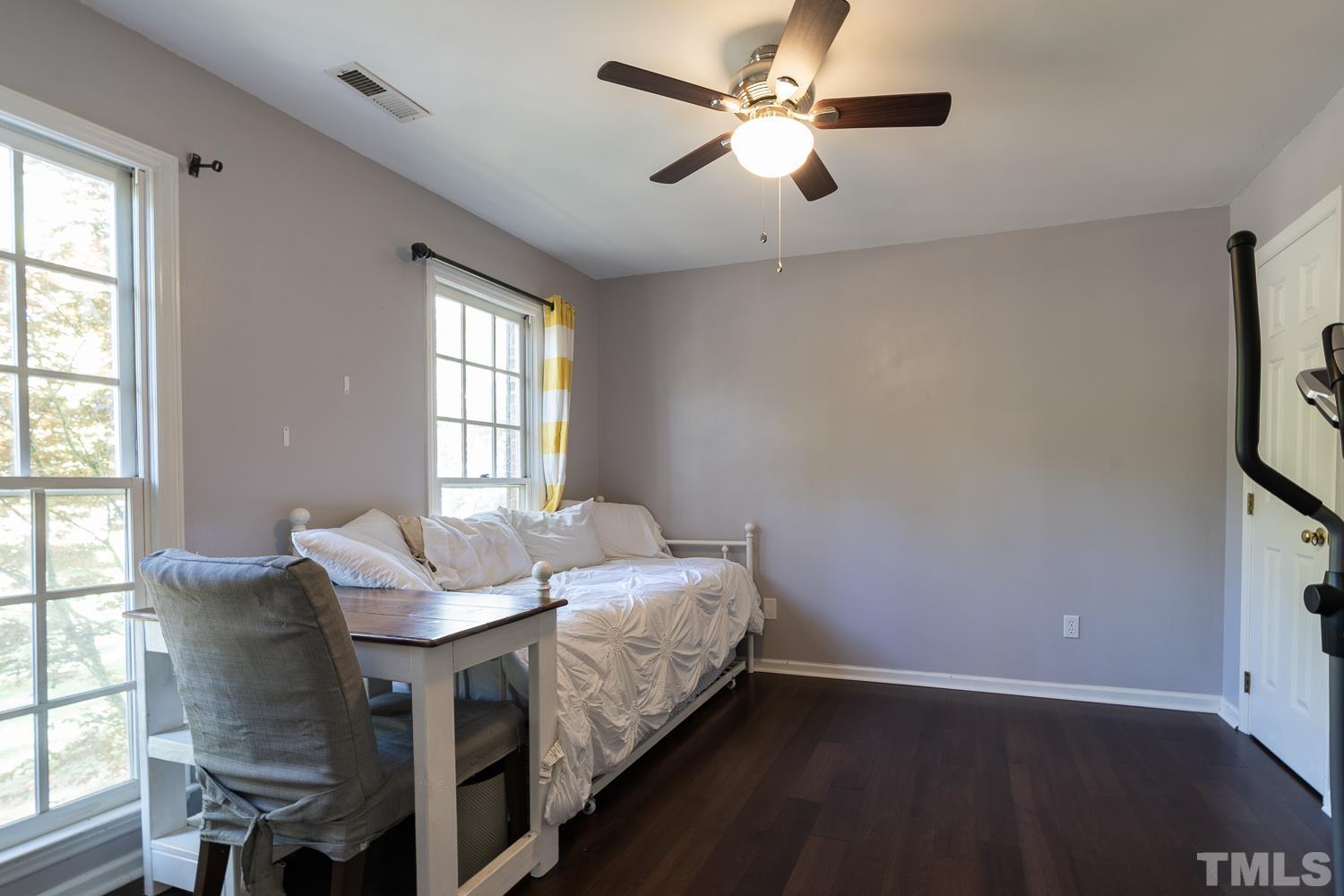 3604 Norway Court Raleigh, NC 27616 - Photo 3 of 26 a bed sitting in a bedroom next to a window