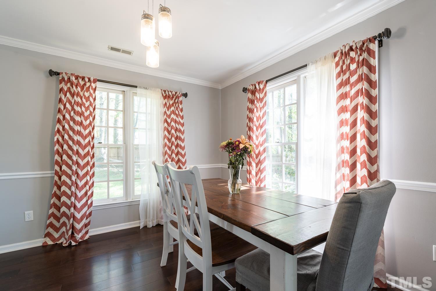 3604 Norway Court Raleigh, NC 27616 - Photo 9 of 26 a view of a dining room with furniture and wooden floor
