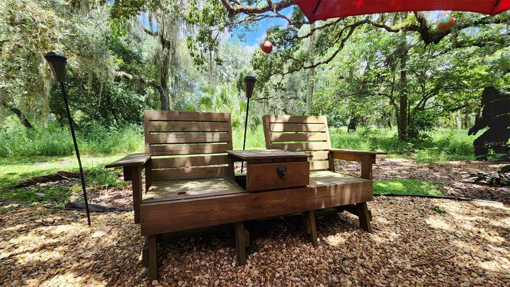 389 Longhorn Drive River Ranch, FL 33867 - Photo 8 of 11 a view of a backyard with sitting area