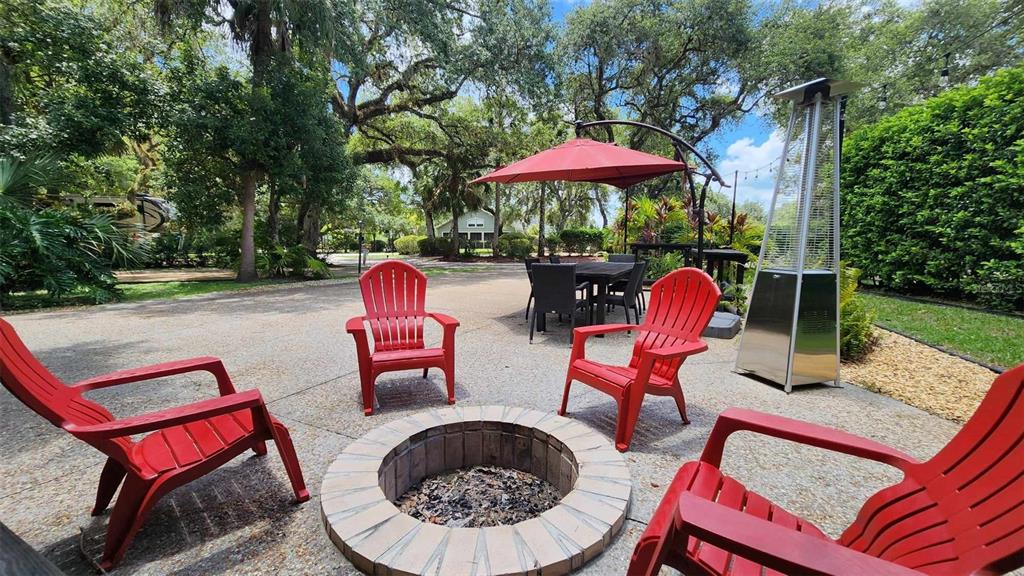 389 Longhorn Drive River Ranch, FL 33867 - Photo 10 of 11 an outdoor sitting area with furniture and barbeque grill