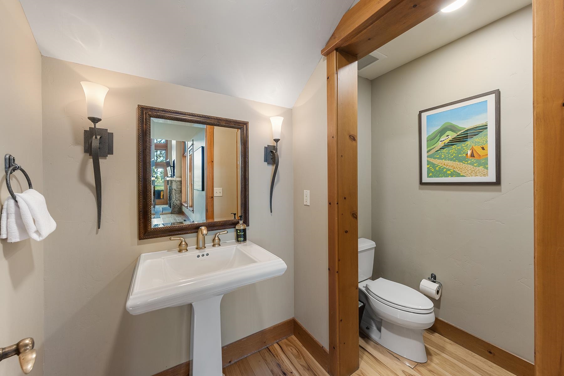 12303 Lookout Loop, Unit F0913 Truckee, CA 96161 - Photo 19 of 27 a bathroom with a toilet a sink and mirror