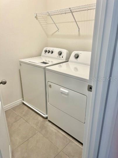 31284 Penny Surf Loop Wesley Chapel, FL 33545 - Photo 9 of 15 a utility room with dryer and washer