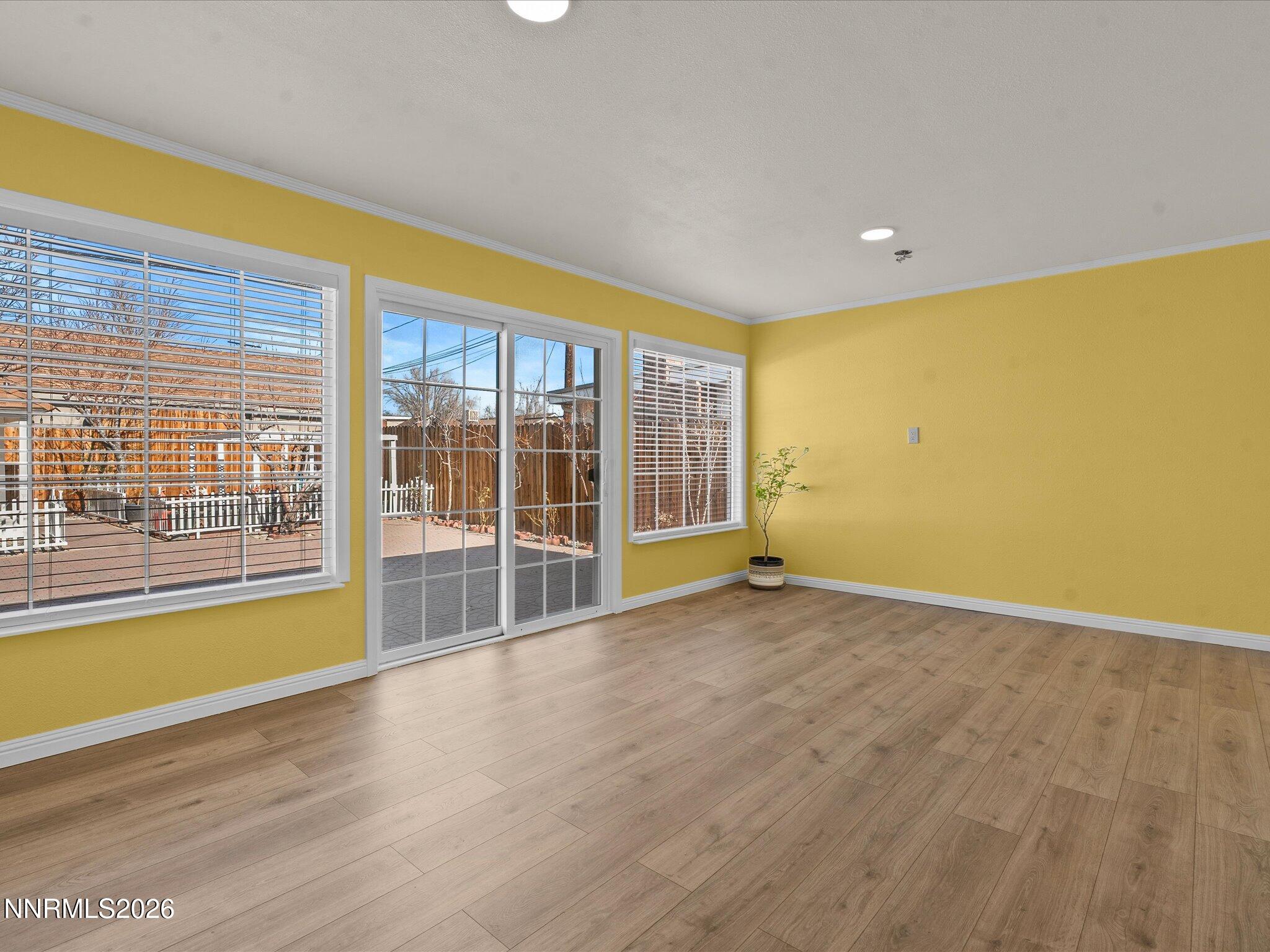 1540 Tyler Way Sparks, NV 89431 - Photo 15 of 35 a view of empty room with wooden floor and fan