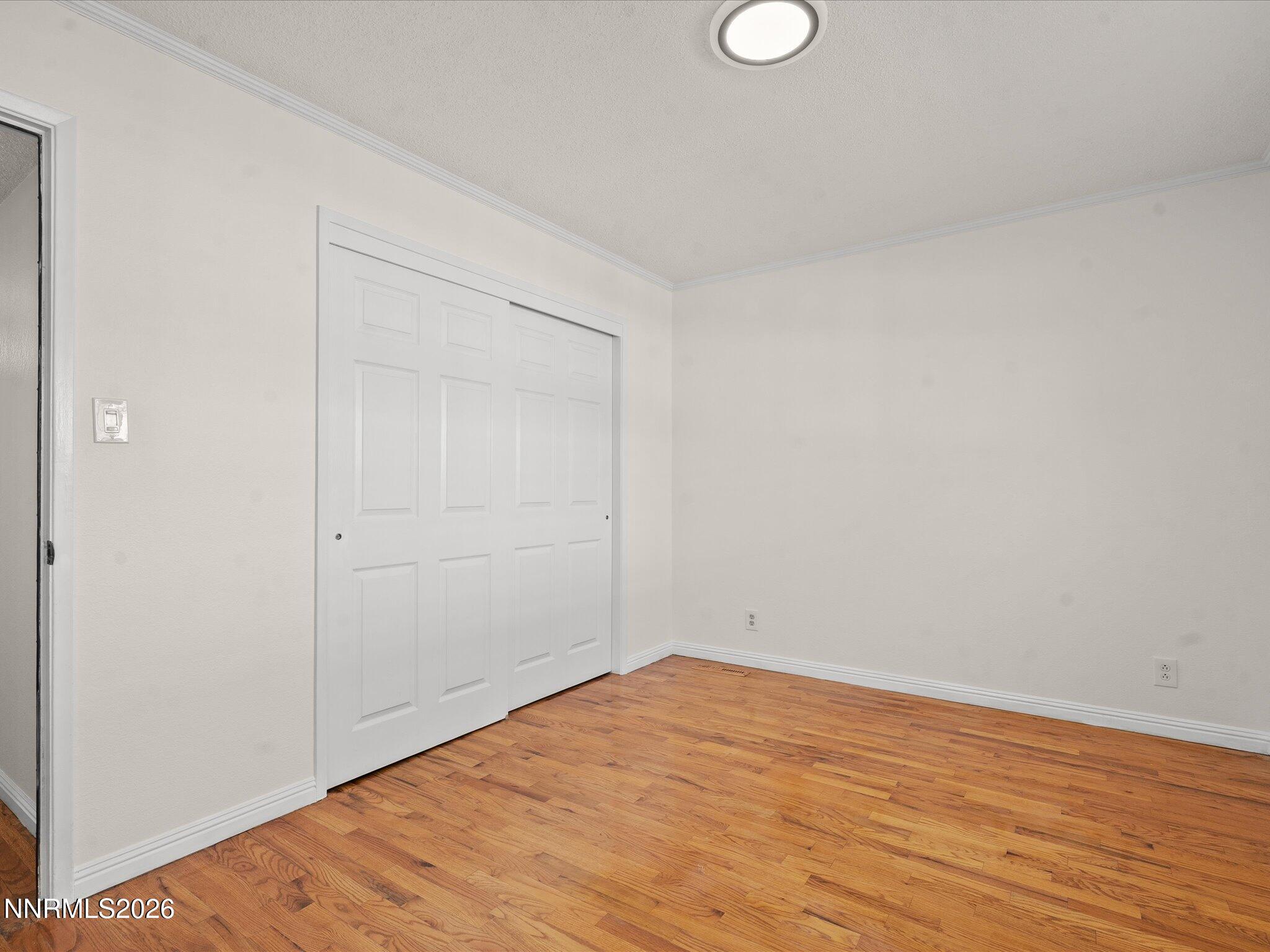 1540 Tyler Way Sparks, NV 89431 - Photo 19 of 35 a view of empty room with wooden floor