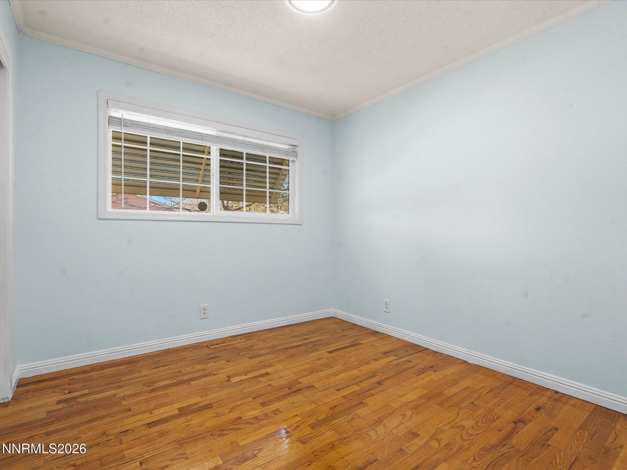 1540 Tyler Way Sparks, NV 89431 - Photo 21 of 35 an empty room with a window