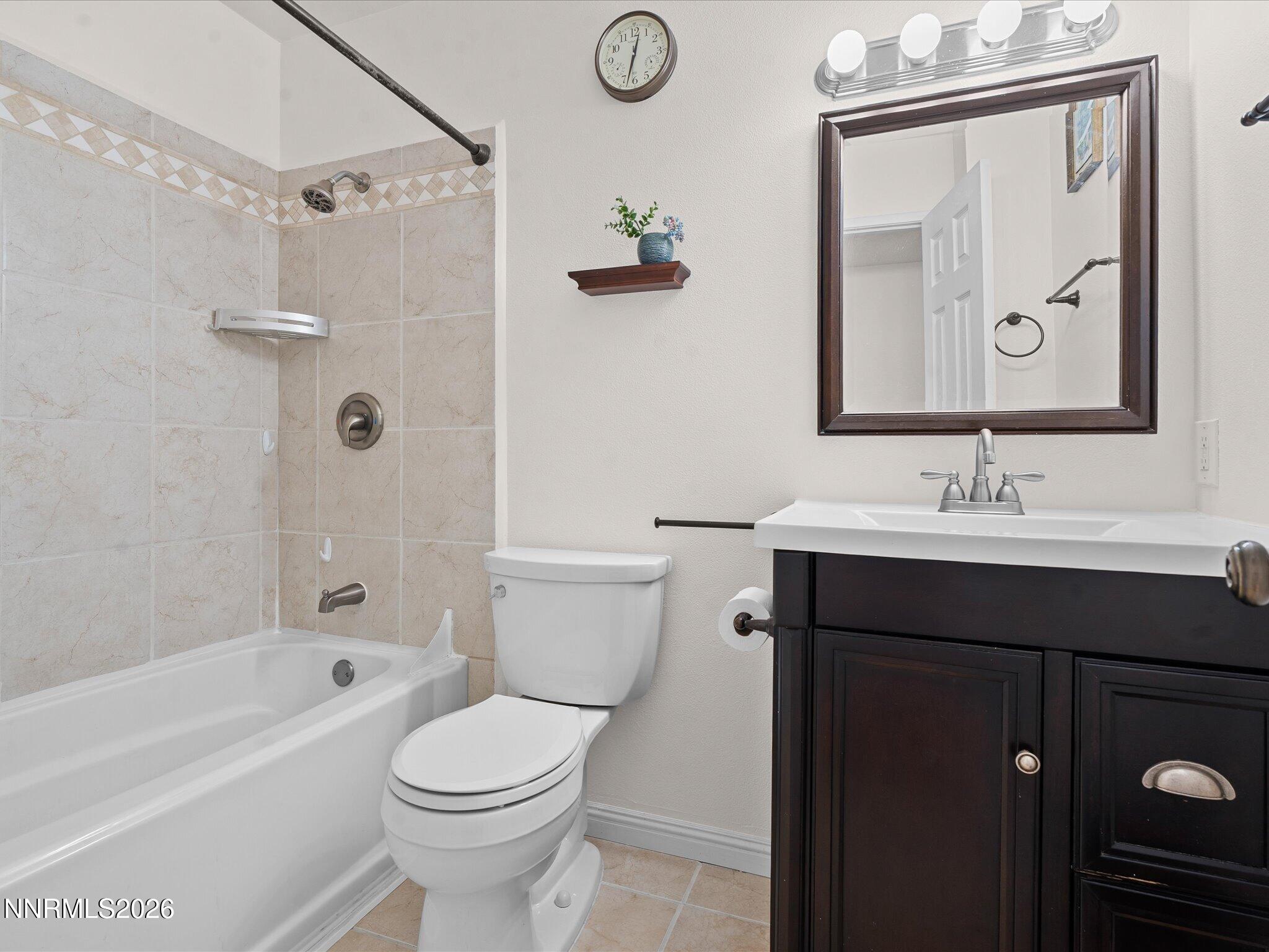 1540 Tyler Way Sparks, NV 89431 - Photo 23 of 35 a bathroom with a sink a toilet and shower