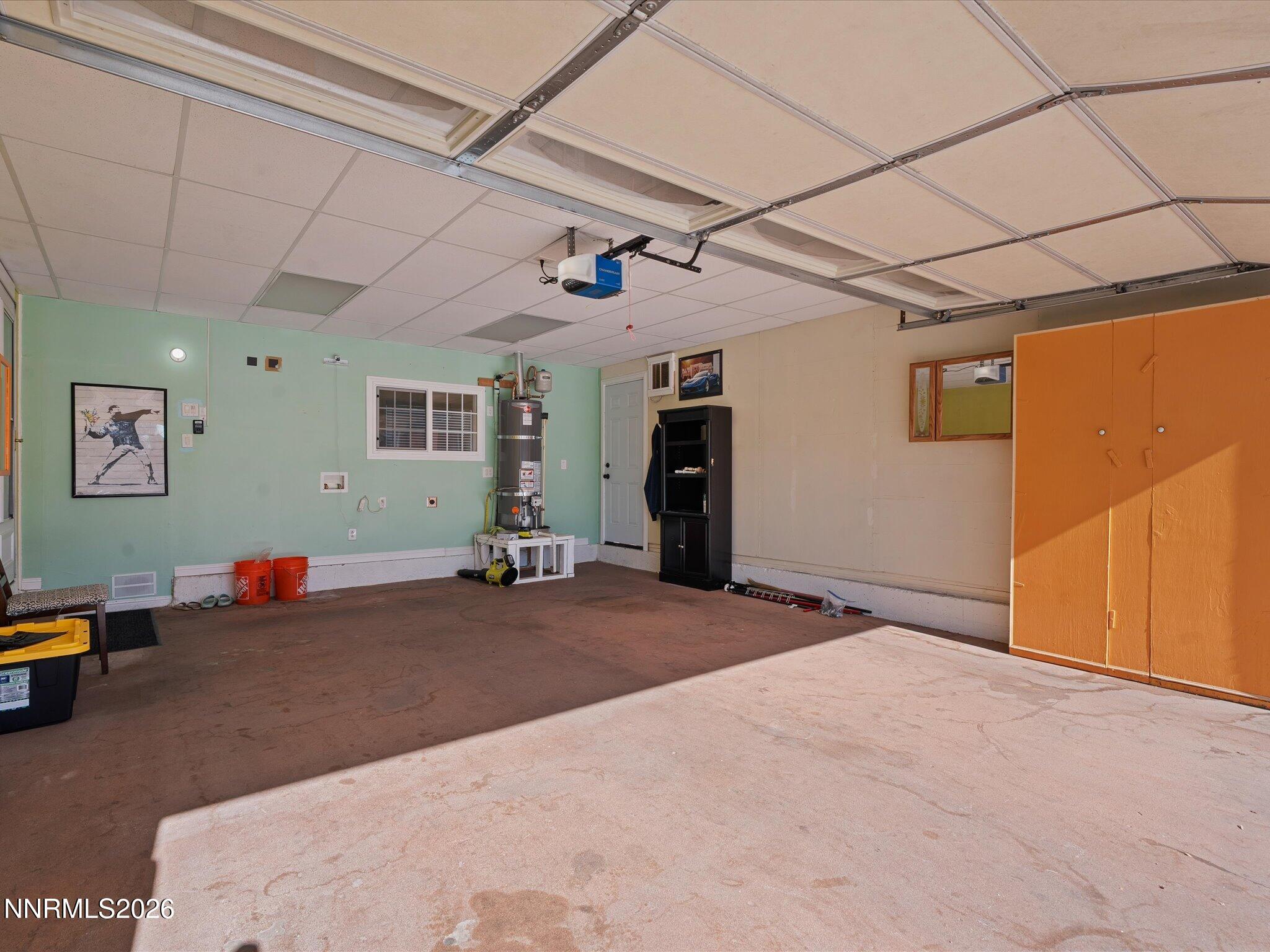 1540 Tyler Way Sparks, NV 89431 - Photo 34 of 35 a bedroom with a bed and a chandelier