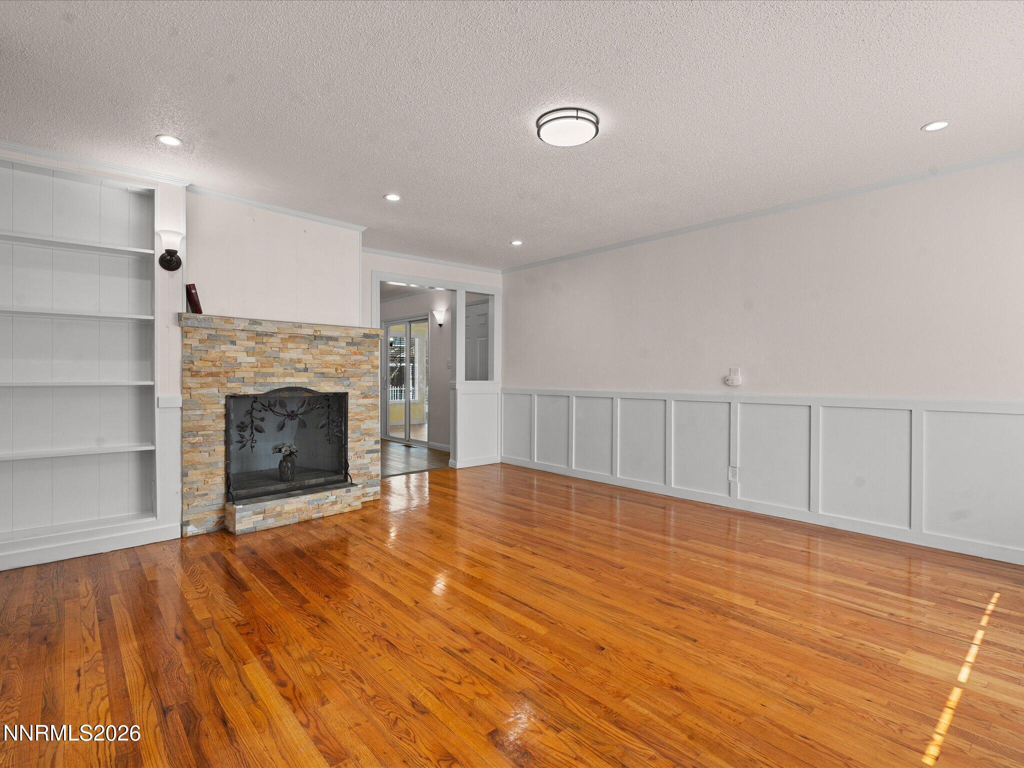 1540 Tyler Way Sparks, NV 89431 - Photo 5 of 35 a view of an empty room with a fireplace and a window