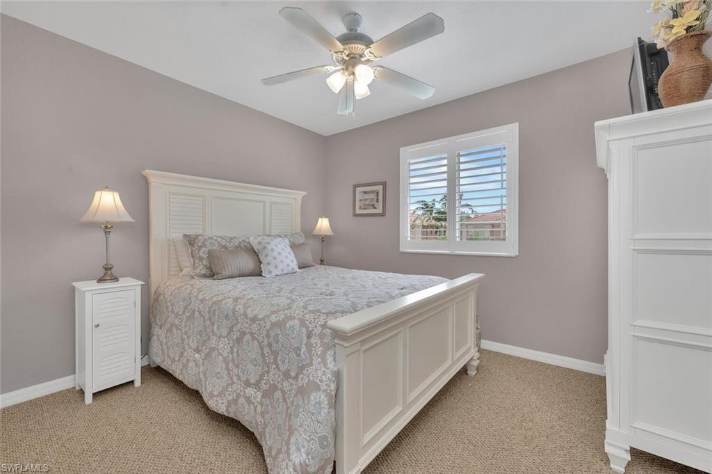 17528 Cherry Ridge Lane Fort Myers, FL 33967 - Photo 12 of 18 a bedroom with a bed and a window