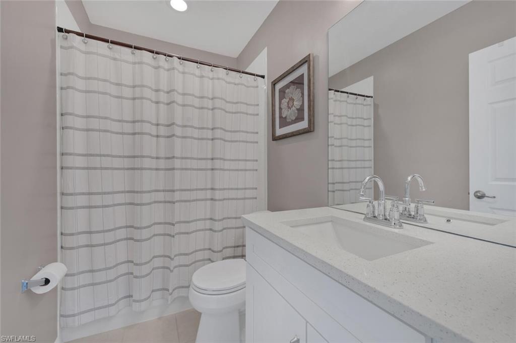 17528 Cherry Ridge Lane Fort Myers, FL 33967 - Photo 13 of 18 a bathroom with a sink toilet and shower