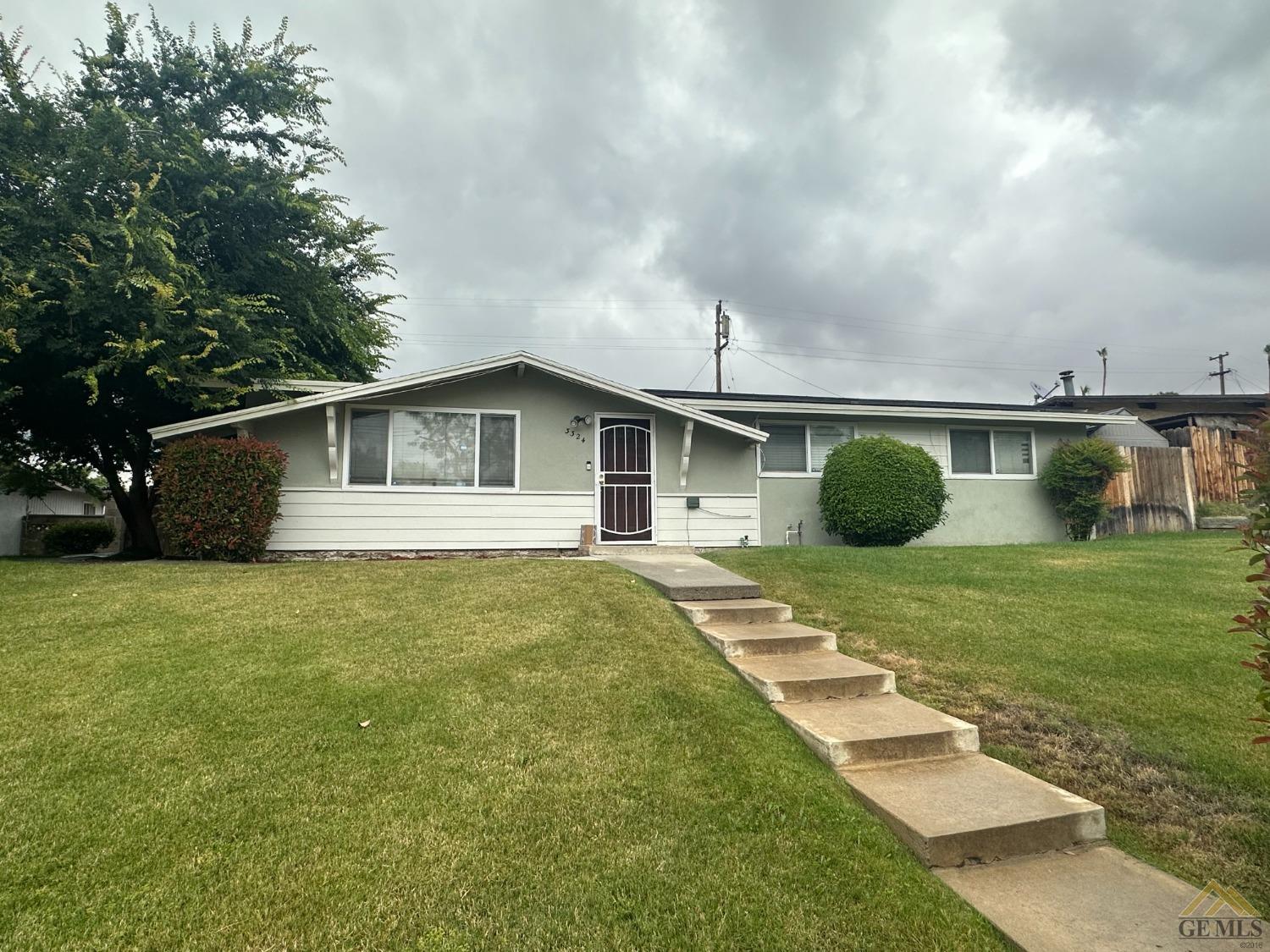 Undisclosed Address Bakersfield, CA 93306 - Photo 1 of 4 a view of a backyard with table and chairs and potted plants