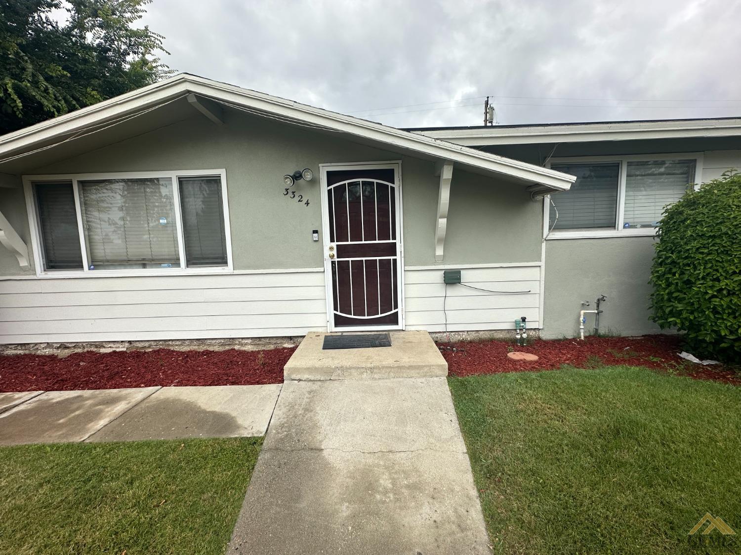 Undisclosed Address Bakersfield, CA 93306 - Photo 2 of 4 a front view of a house with yard