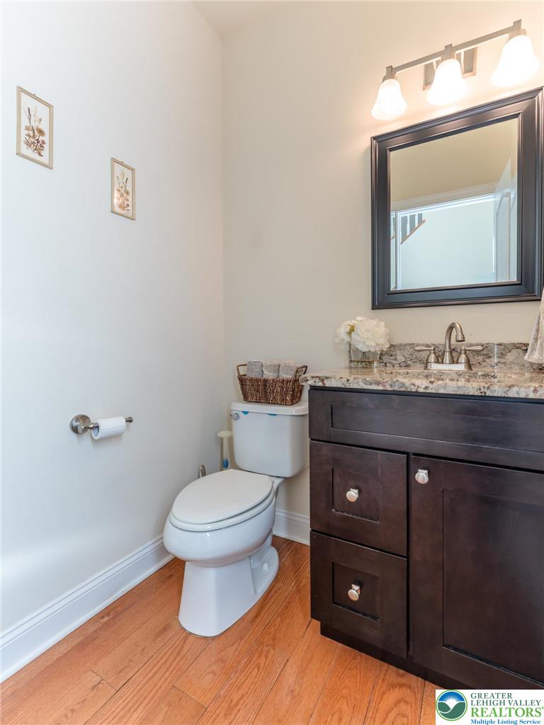 3505 Woodbyne Road Hellertown, PA 18055 - Photo 23 of 66 a bathroom with a toilet sink and mirror