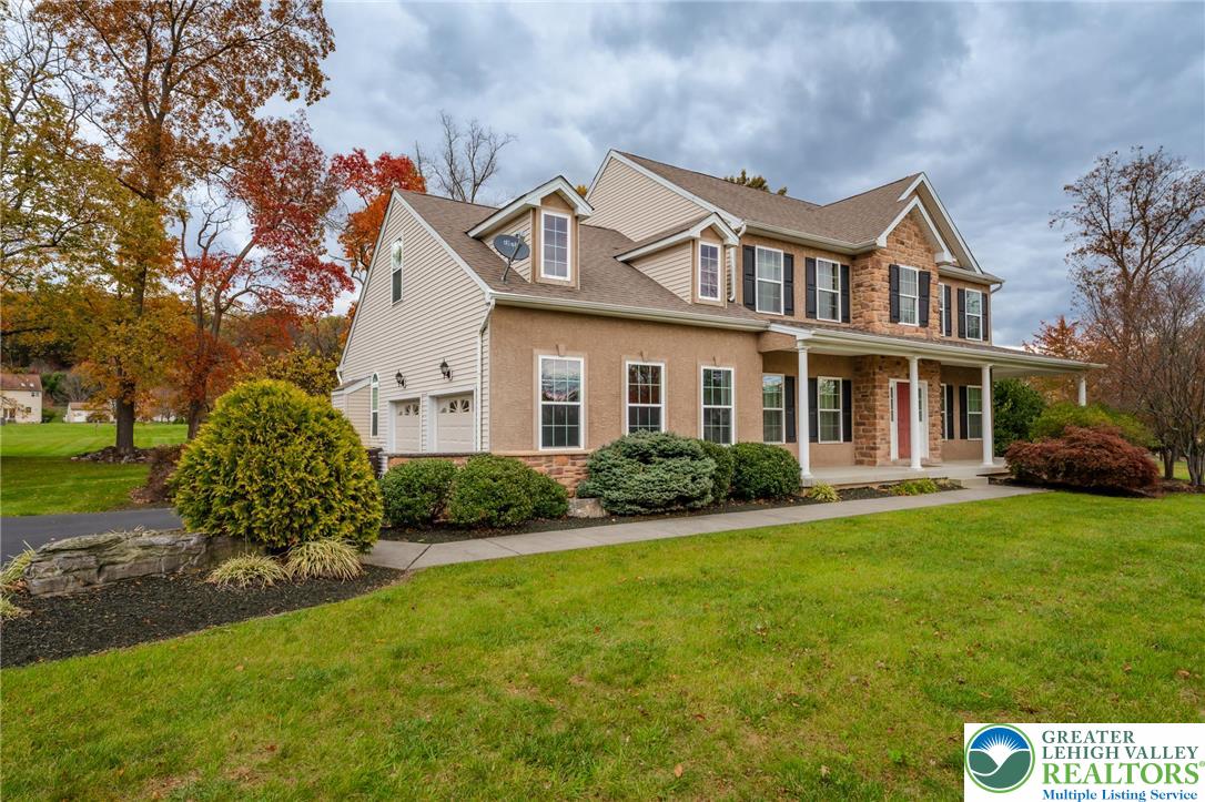 3505 Woodbyne Road Hellertown, PA 18055 - Photo 3 of 66 a front view of a house with garden