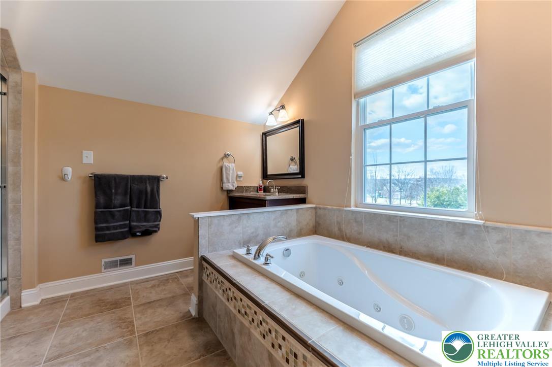 3505 Woodbyne Road Hellertown, PA 18055 - Photo 32 of 66 a bathroom with a bathtub and a sink