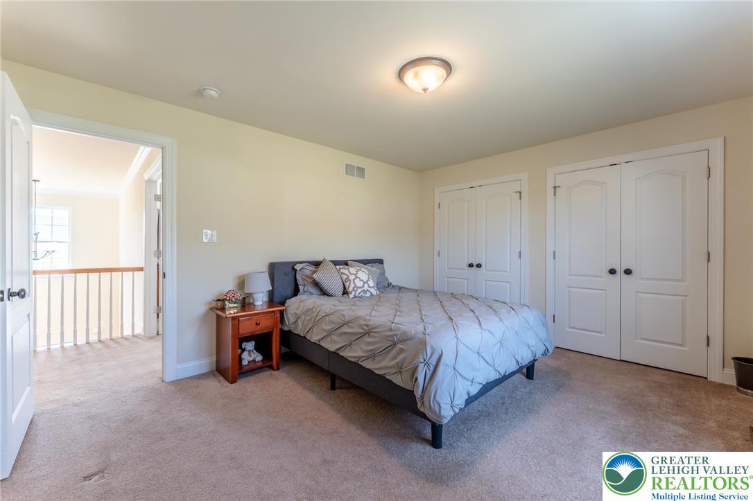 3505 Woodbyne Road Hellertown, PA 18055 - Photo 36 of 66 a spacious bedroom with a bed and a table