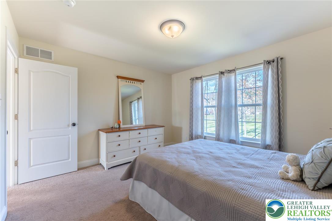 3505 Woodbyne Road Hellertown, PA 18055 - Photo 39 of 66 a bedroom with a bed and a window