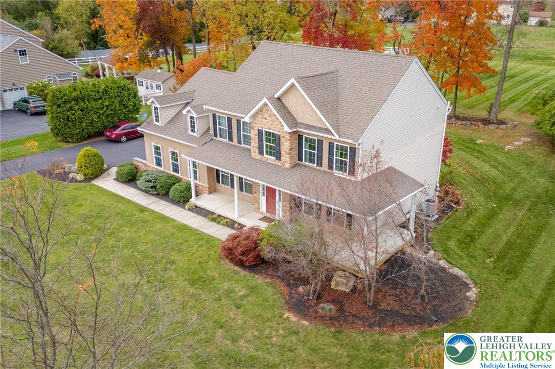 3505 Woodbyne Road Hellertown, PA 18055 - Photo 4 of 66 a aerial view of a house with a yard and plants