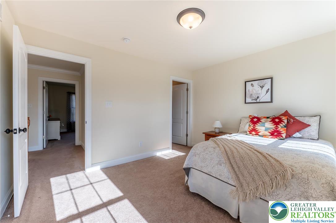 3505 Woodbyne Road Hellertown, PA 18055 - Photo 41 of 66 a bedroom with a bed and a view of bathroom