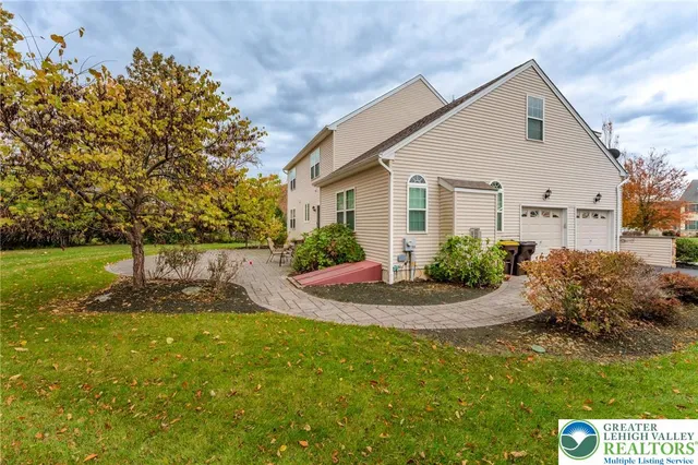 a swimming pool view with a outdoor seating