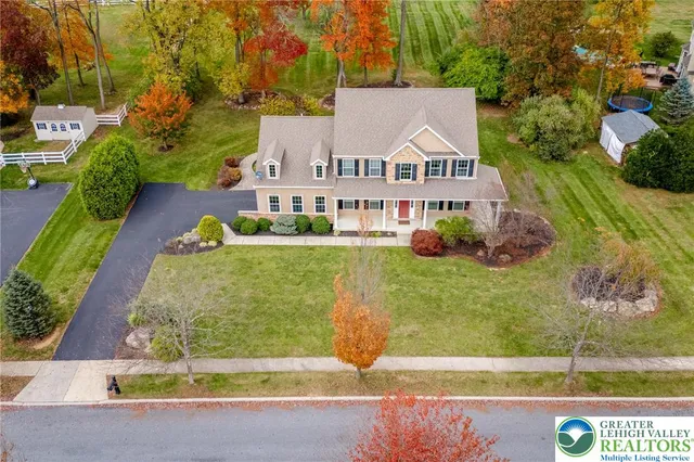 an aerial view of house with yard
