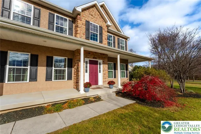 a living room with furniture a lamp and a window